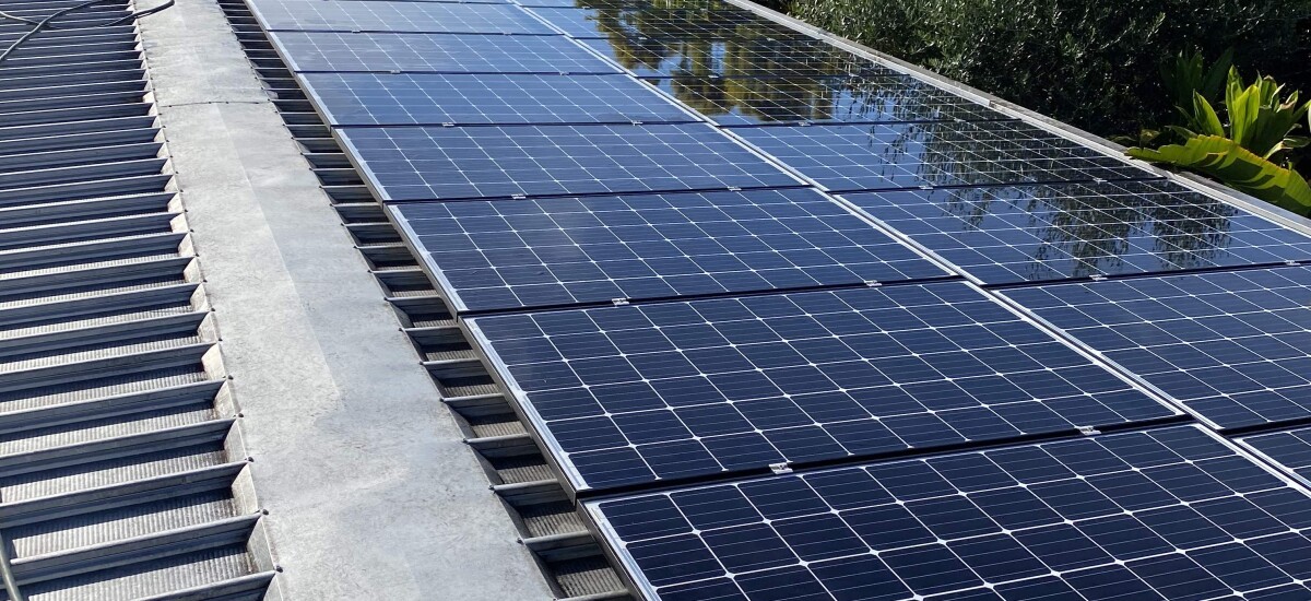 A large array of solar panels that have just been cleaned