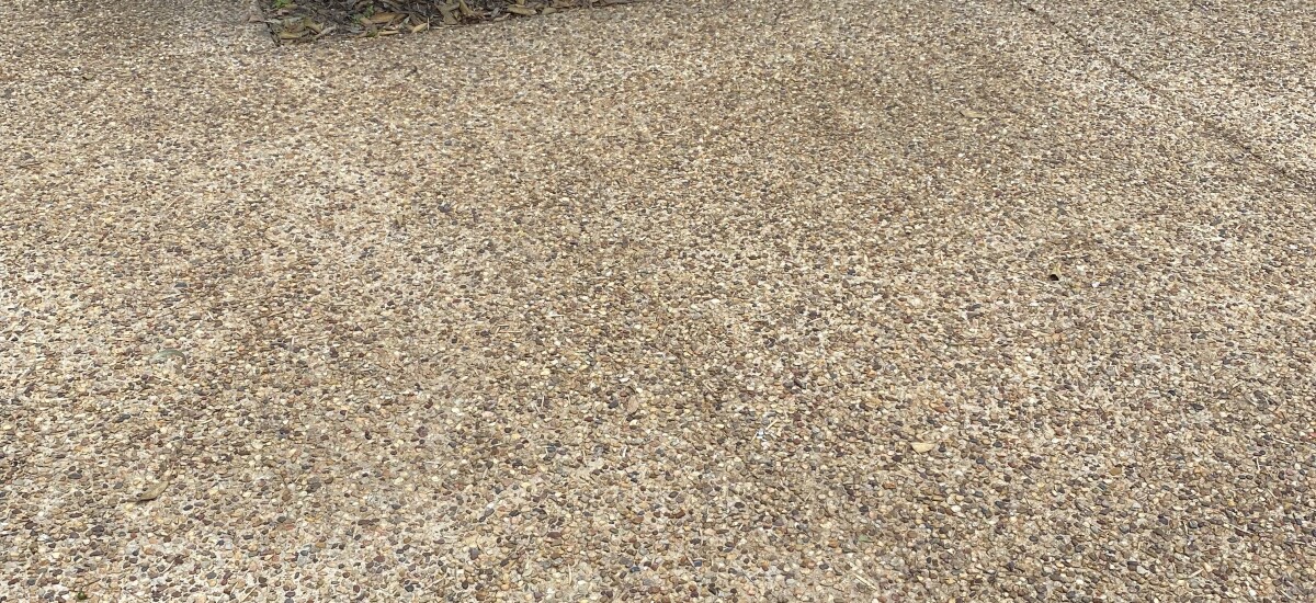 A clean driveway that has been cleaned with a high pressure washer